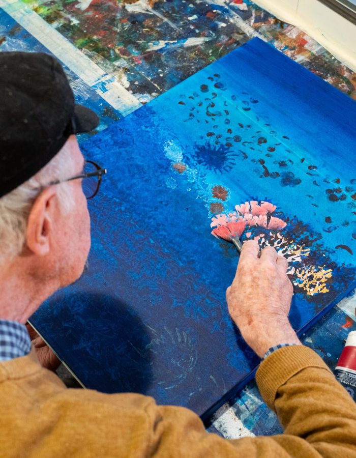 Pablo Penchaszadeh, retired professor of marine biology and now artist-at-sea on board of R/V Falkor (too). works on one of his paintings in the Main Lab of the ship. .

CREDIT: Misha Vallejo Prut / Schmidt Ocean Institute