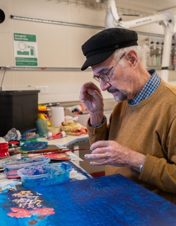 Pablo Penchaszadeh, retired professor of marine biology and now artist-at-sea on board of R/V Falkor (too). works on one of his paintings in the Main Lab of the ship. .

CREDIT: Misha Vallejo Prut / Schmidt Ocean Institute